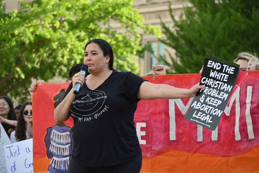 Sikowis Nobiss, founder and executive director of the Great Plains Action Society, speaks. She brought signs for protesters to take, and spoke on the importance of reproductive rights and the rights of indigenous communities around the country. 