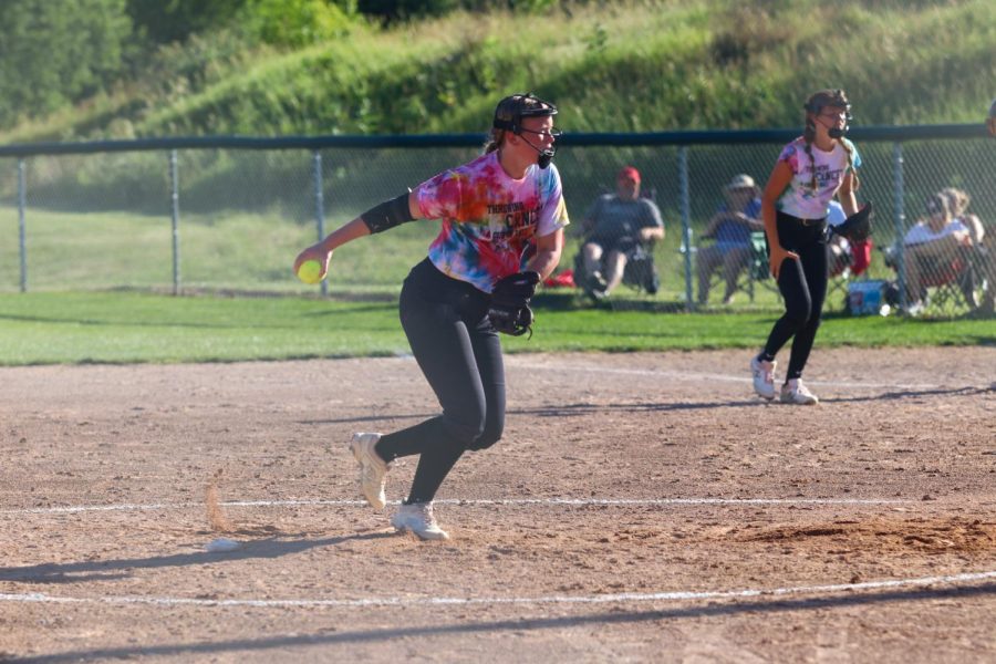 Max Peck '25 pitches the ball in the third inning of the first game against City High on June 22, 2022. 