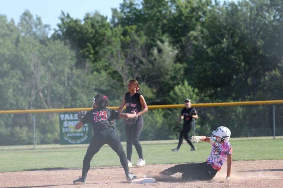 Ella Nelson 23 slides to second base in the first game against City High on June 22, 2022. 