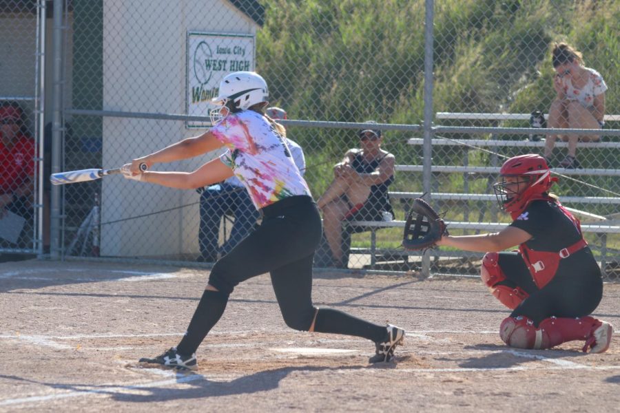 Maddie Caylor 22 swings ar the ball during the double header against City High on June 22, 2022.