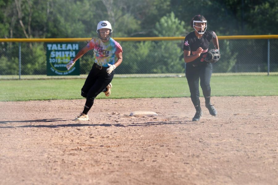 Tamiah Teran looks to run to third base against City High on June 22, 2022. 