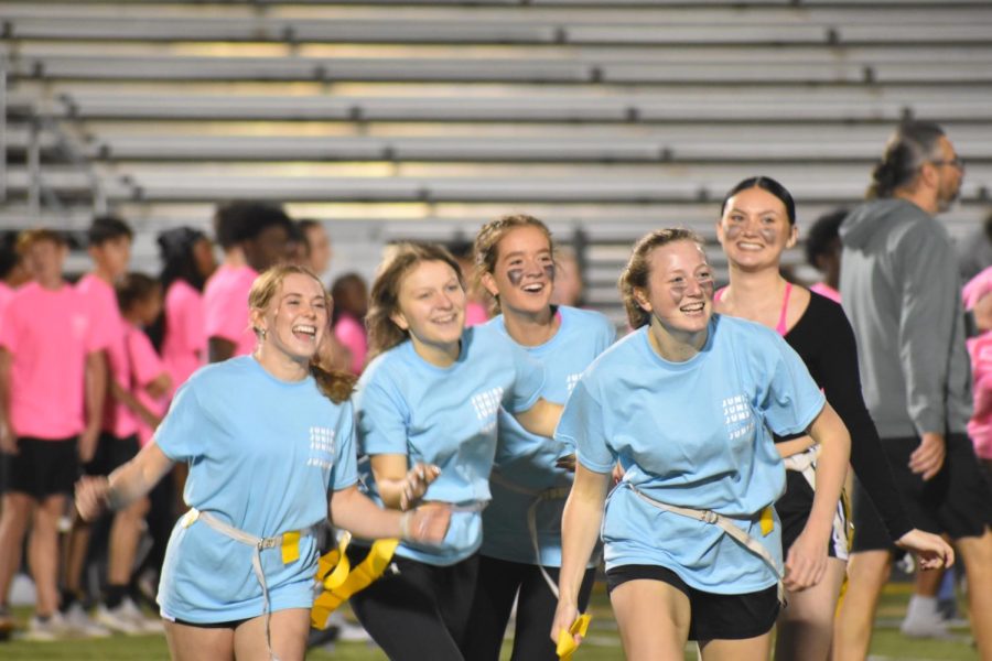 Taylor Stevens 24, Ashley Bedord 24, Whitney Noeller 24, Lucy Wolf 24 and Ava Rhoades 24 celebrate after a touchdown