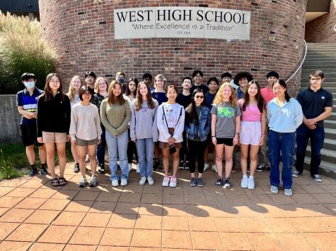 The National Merit Scholar semi-finalists pose for a photo in from of West High