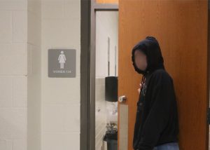 An ambiguous student enters the bathroom. Many students vape in the bathroom during the school day.