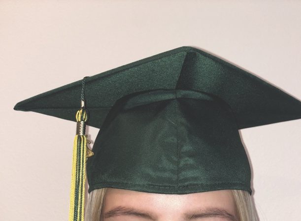 The Trojan green cap and gown is a West High graduation essential.