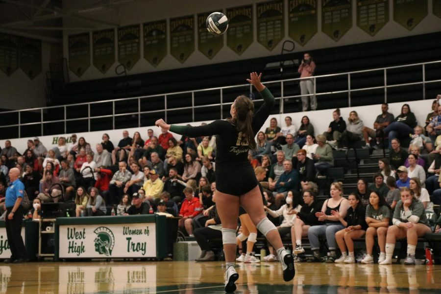 Lexi Nash 23 serves the ball during the second set of the match against City High on Oct. 4, 2022. 