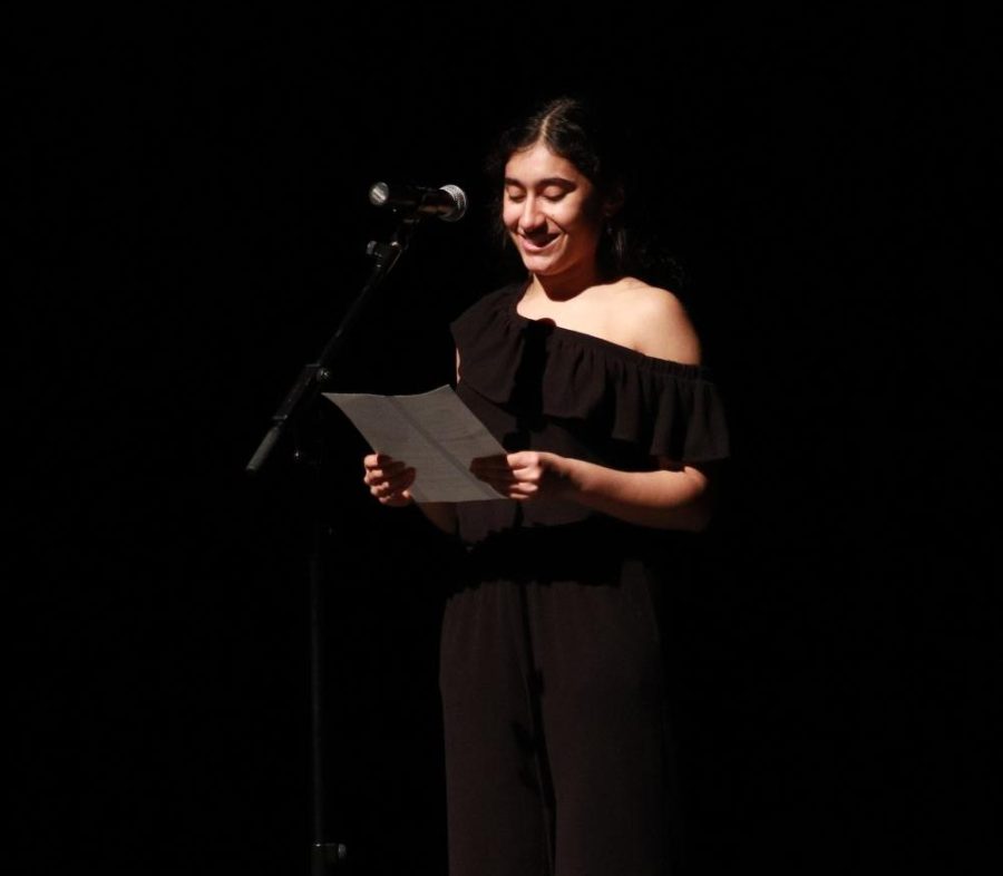 Krisha Kapoor 23 gives the closing speech at the annual Iowa MOST Benefit Concert