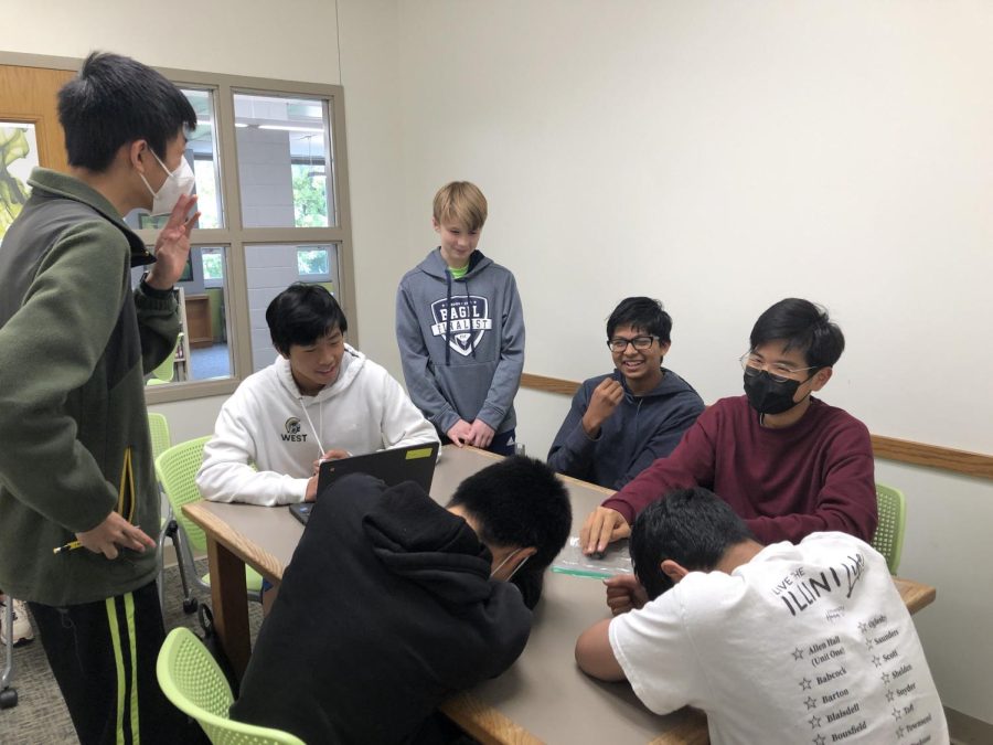 The returning rocketry team members share a moment of laughter after school in the library. It was their first meeting of the year since the competition this past spring.