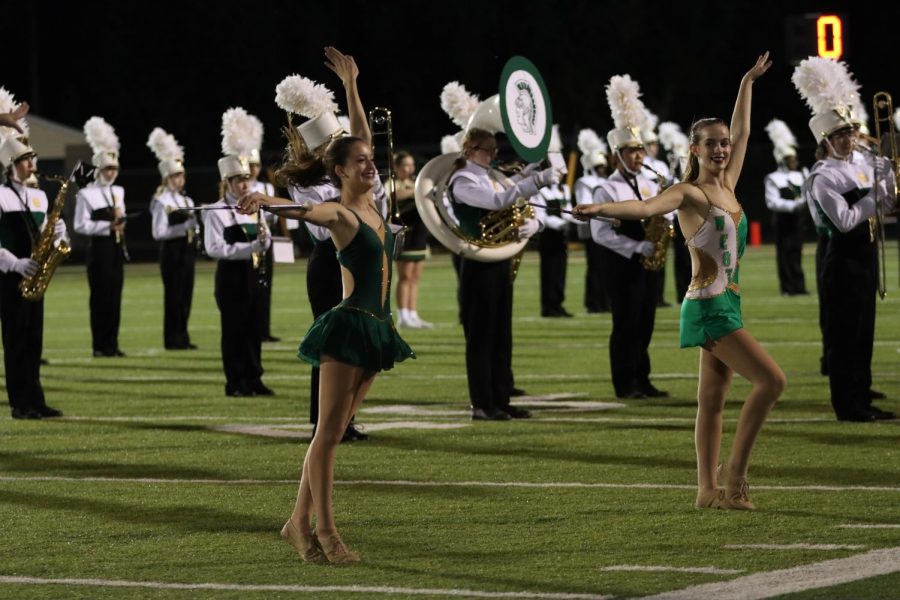Ava Frese 26 and Lauren Yacopucci 26 perform in front of the West High band at halftime of the football game Sept. 2.
