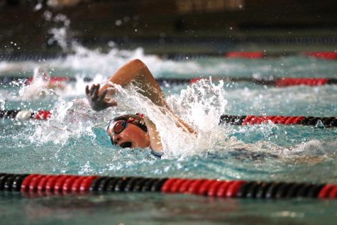 Gretchen Gerke 26 takes a breath during the 500 freestyle Oct. 5 at Clinton High School.