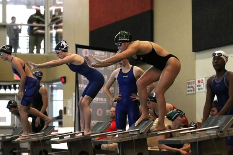 Jade Roghair 23 prepares for her leg of the 400 freestyle relay at the regional swim meet Oct. 5.