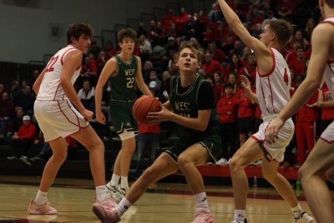 Brady Simcox 23 looks for a layup opportunity Jan. 20 while away at Linn Mar.