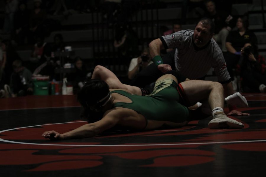 Justin Avila 25 tries to pin his City High opponent at 160. 