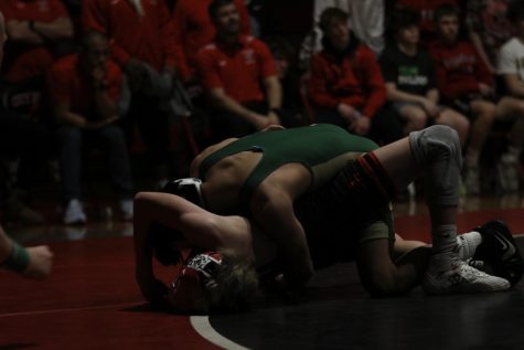 Alex Pierce 26 looks to win by fall at 106 at City High, Jan. 12. 