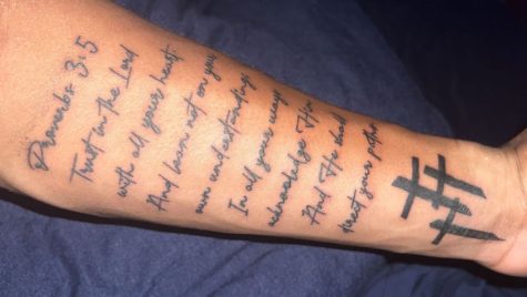 Daniel Robinson 24 shows his tattoo he got in honor of his mother