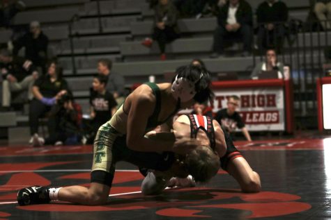 Alex Pierce 26 wins by major decision against his City High opponent on Jan. 12. 