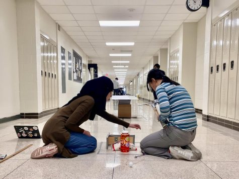 Catherine Xu 26 and Shahd Suleiman 26 prepare for their event Trajectory Feb. 4 at the regional competion.