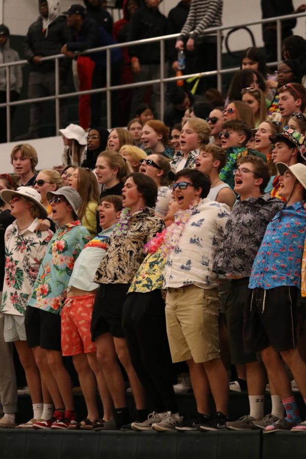 The student section turns up the energy in the gym with a thunderous cheer.