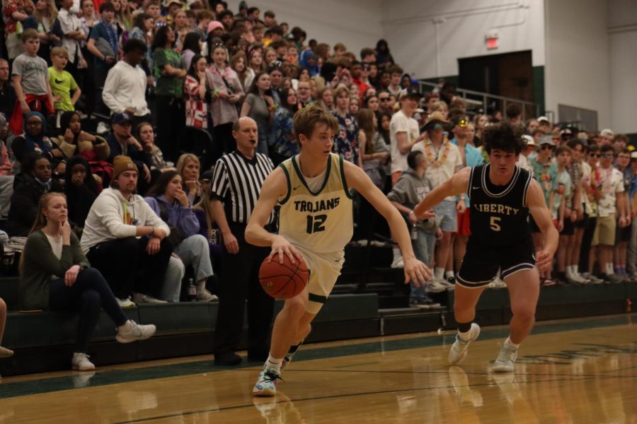 Junior Jacob Koch gets past a Liberty defender for a two-pointer in the second quarter.