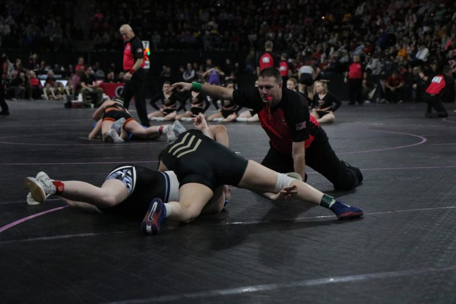 Jannell Avila pins her opponent during the state wrestling tournament.