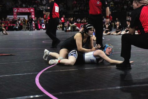 Jannell Avila 23 pins opponents arm behind back at girls state wrestling. 