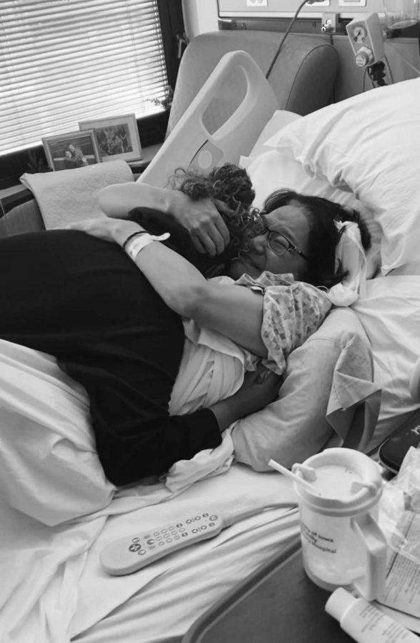 Keiko and her mom embrace during her ongoing cancer treatment.