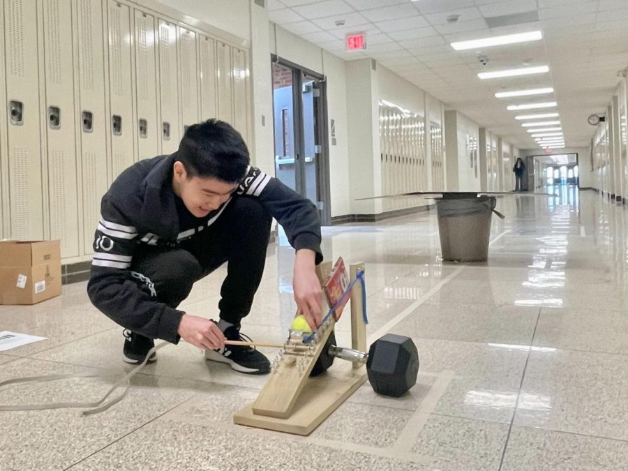 Joseph Lin 25 working on his trajectory project for Science Olympiad regionals. 