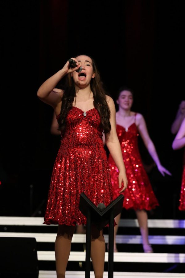 Avanley Jones 25 singing during a show choir competition. 