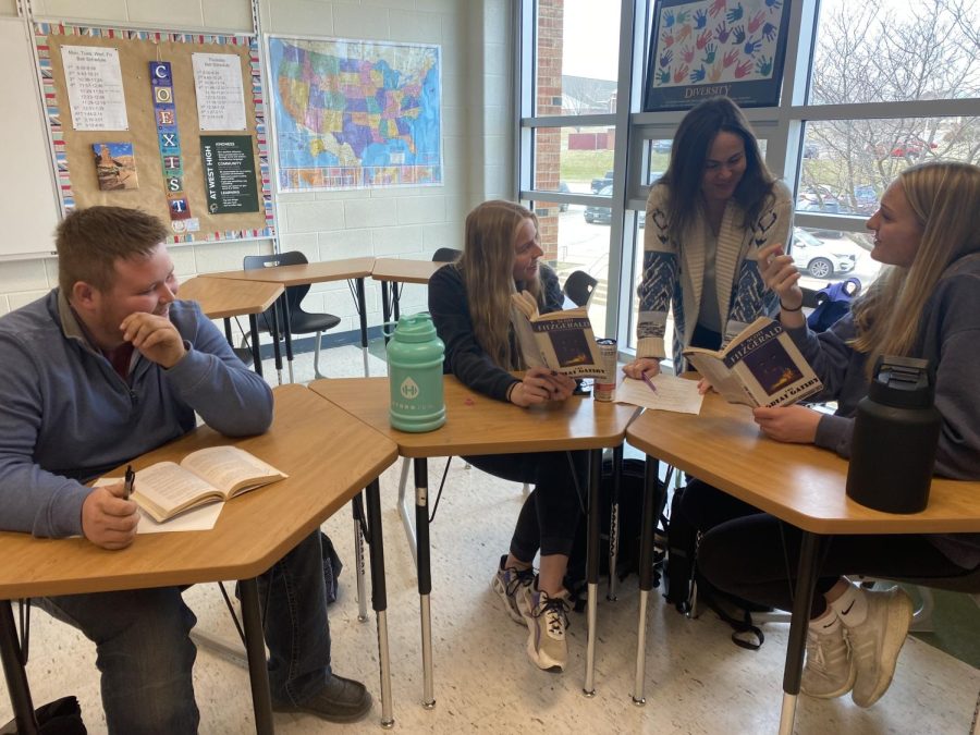 Caiden Sweeting, Grace Miller, Ms. Witthoft, and Sophia Deyak prepare for their first socratic seminar discussion over F. Scott Fitzgeralds, The Great Gatsby.