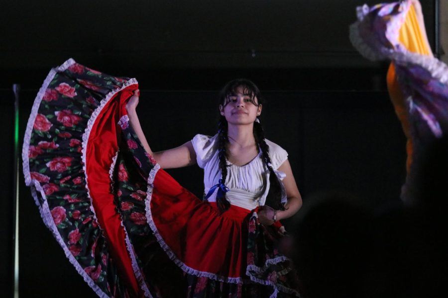 Silvia Martinez 24 performs a traditional Folkorio dance at Walk It Out April 8.