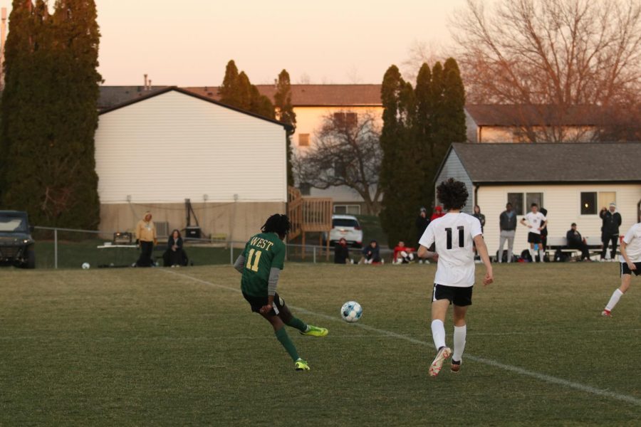 Ismail Mohamed 24 strikes the ball down the field towards Cedar Falls goal.