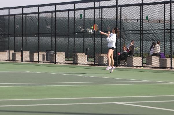 Maggie Shin ’24 gets back in time to hit a deep forehand during her match at the girls tennis meet against Liberty High April 18.