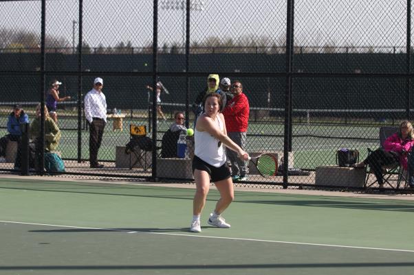Luther College commit Jay Mascardo ’23 prepares to hit a backhand during her match at the girls tennis meet against Liberty High on the West High tennis courts April 18.