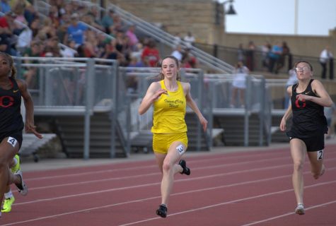 Annie Schwartz 23 races in the 100-meter dash in a qualifying time of 12.59 seconds. 