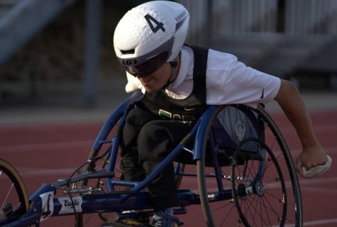 Jordan Caperon 23 races the 100 meter wheelchair.