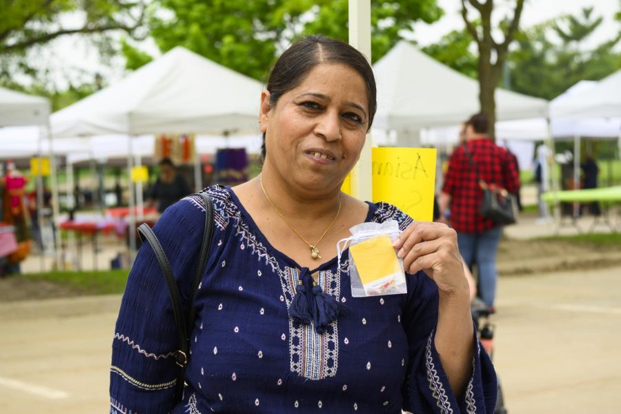 West High paraeducator Samina Naz sells handmade jewelry at the Coralville Asian Festival. 