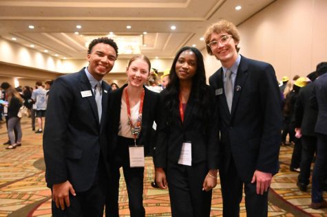 Myra Crawford 26 and Helelia Kalala 23 pose for a photo with 2022 BPA National Executive Board officers.
