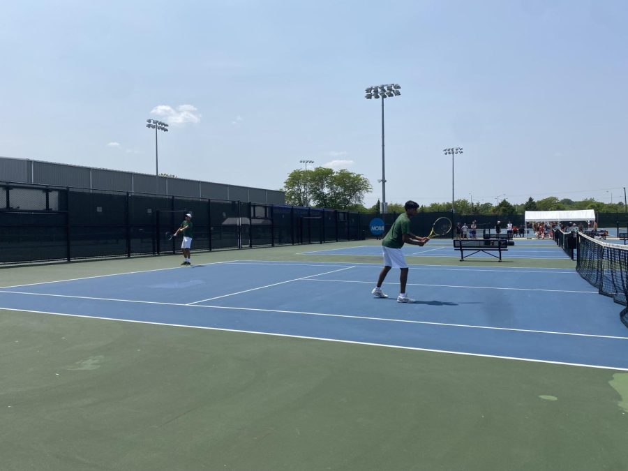 Samir Singh 24 serves as Shivy Mannengi 23 prepares for the return during their match for seventh place at the state singles/doubles tournament at the Hawkeye Tennis and Recreation Complex May 24.