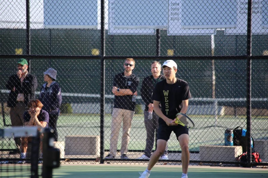 Senior Jayden Shin plays a singles match during a home meet on May 3rd, 2023. 