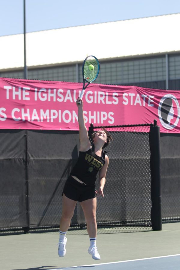 Jay Mascardo ’23 hits a serve in the semi-finals of the individual state tournament May 27.