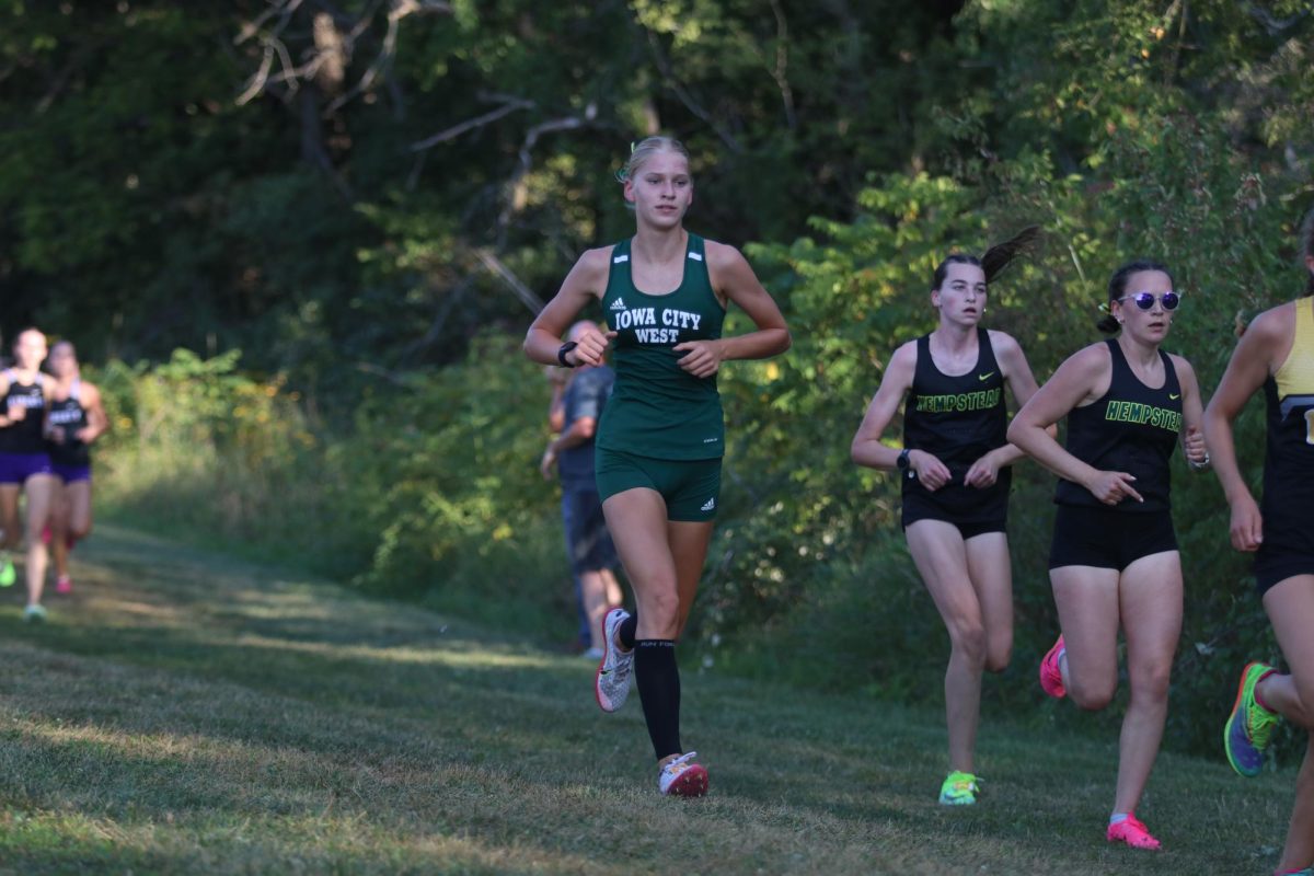 Kate Van Waning 26 asserts herself in the front pack of the varsity race Aug. 28. 