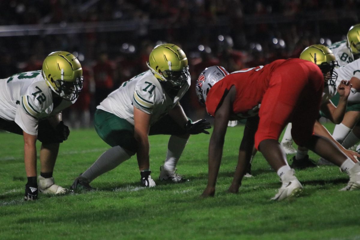 Offensive lineman Jeffery Karr 24 lines up against City High Sept. 15 against City High. 
