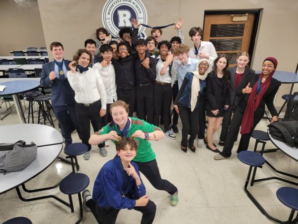The West High Speech and Debate team poses at the end of Tournavelt, securing the title of overall runner-up in Lincoln-Douglas and champions in both Novice and Varsity Public Forum categories.