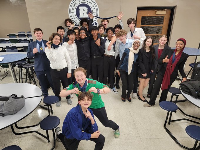 The+West+High+Speech+and+Debate+team+poses+at+the+end+of+Tournavelt%2C+securing+the+title+of+overall+runner-up+in+Lincoln-Douglas+and+champions+in+both+Novice+and+Varsity+Public+Forum+categories.
