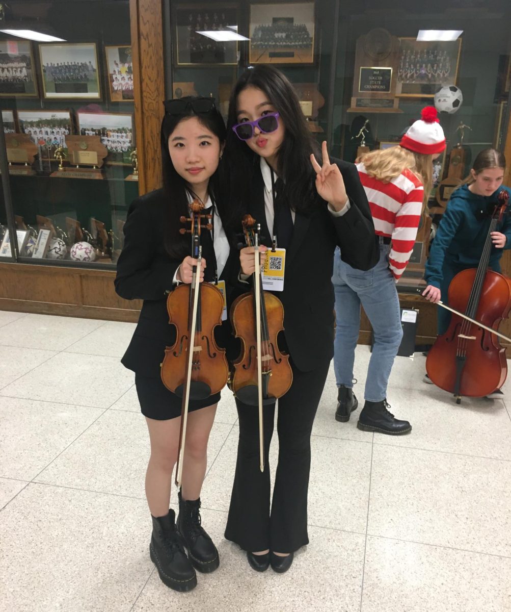 Esther Park '25 and Jessie Li '25 dressed up as Men In Black. 