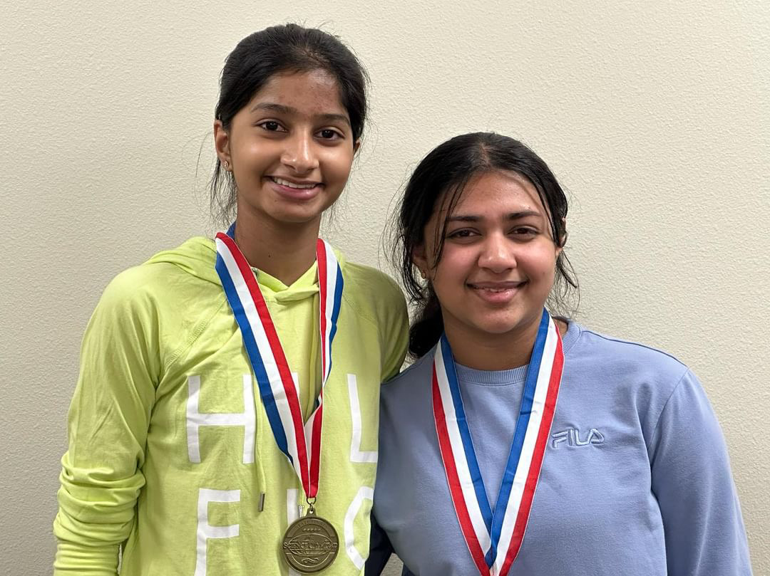 Vuppala and Mathews receive gold for the Flight event at the Science Olympiad State Competition. 