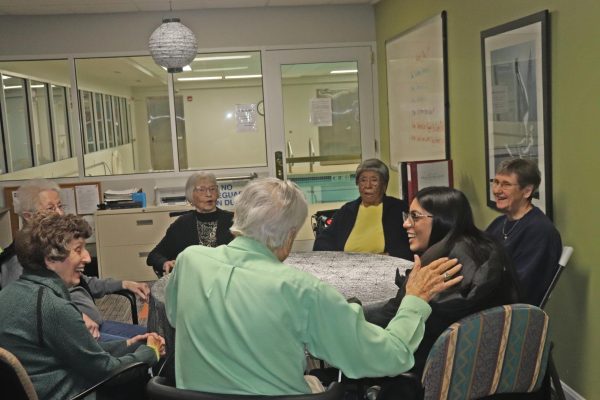 Zaira Ahmad 24 talks with Melrose Meadows residents Nov. 1 during a 1440 Interact volunteer opportunity. 