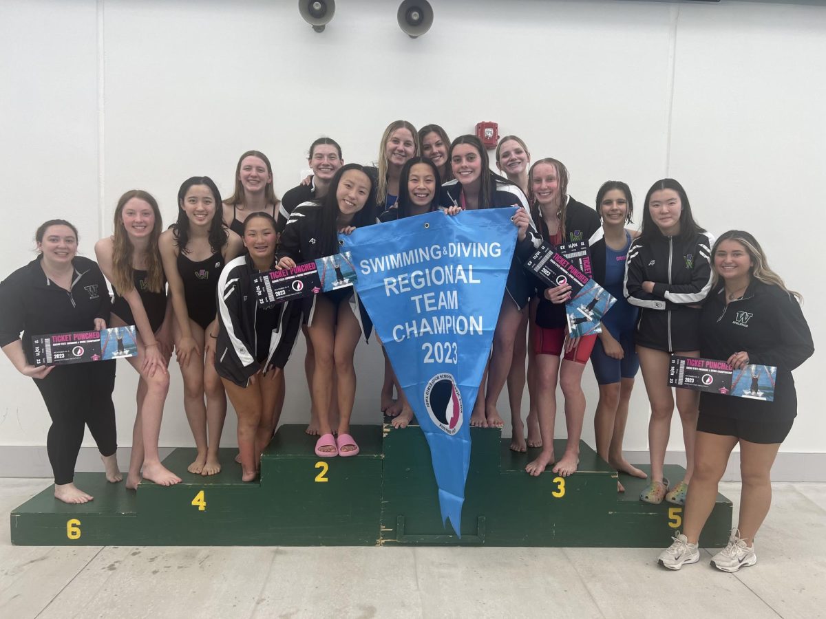 The girls swimming and diving team pose for a photo.