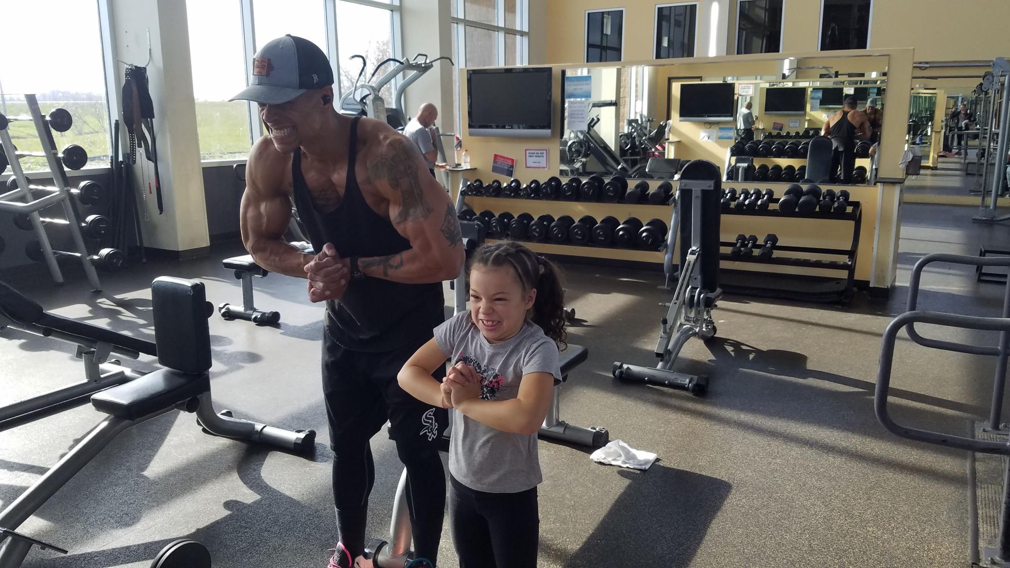 Amari Nasafi poses with his daughter after training