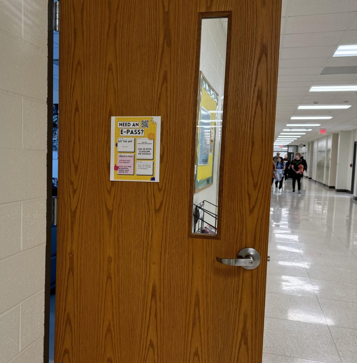 Signs hang around the school to educate students on how to use the new e-hall pass system